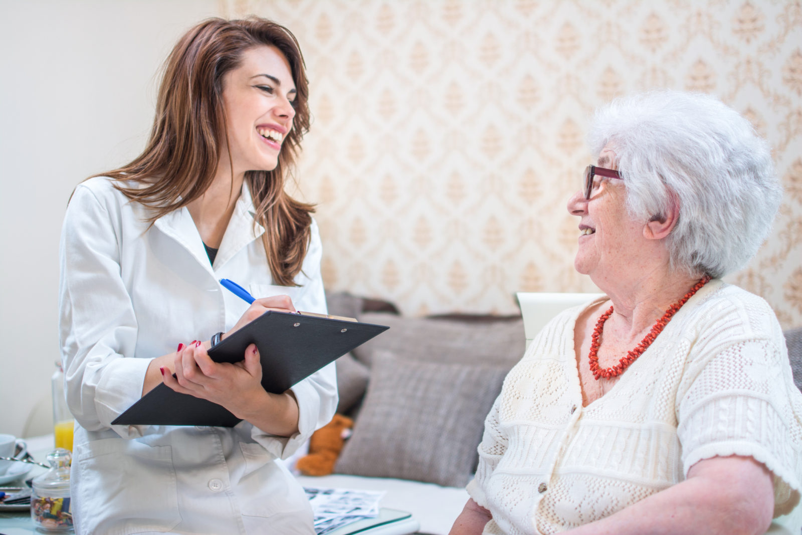 Discharge planner at Rehab facility with senior woman patient