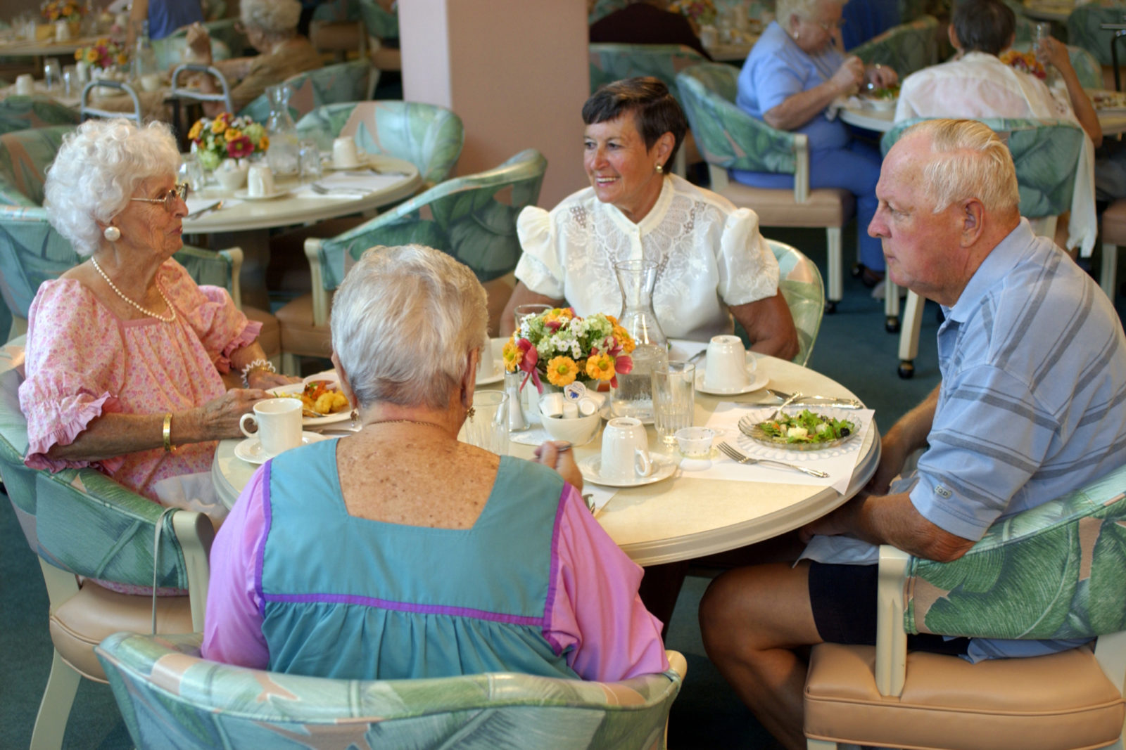 group of seniors dining in an assisted living community