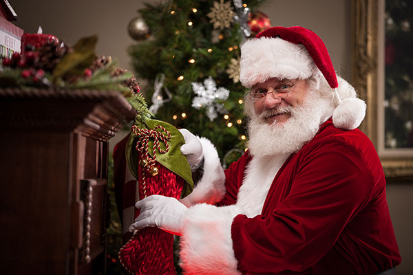 Santa Claus filling a stocking