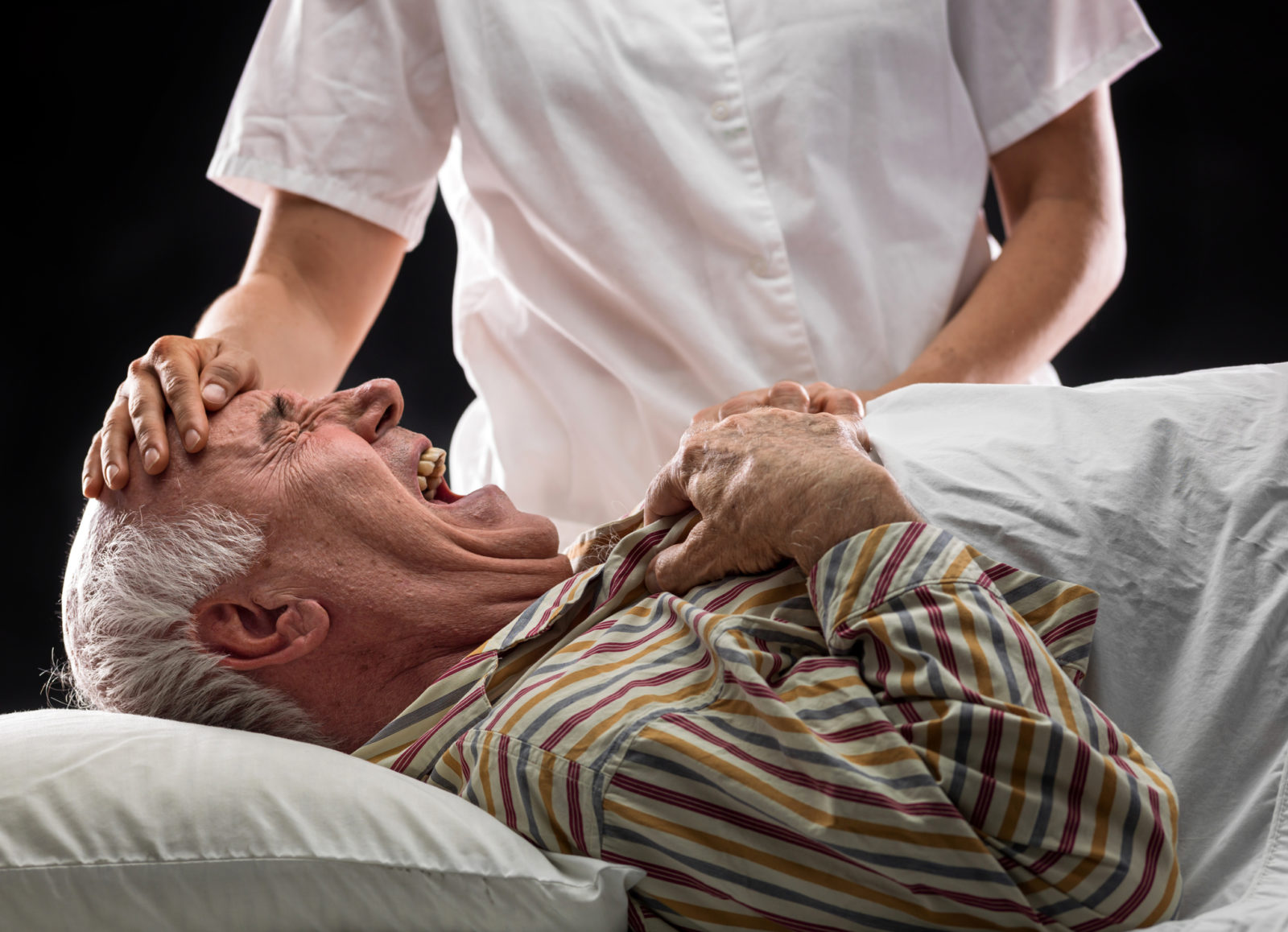 man in hospital bed