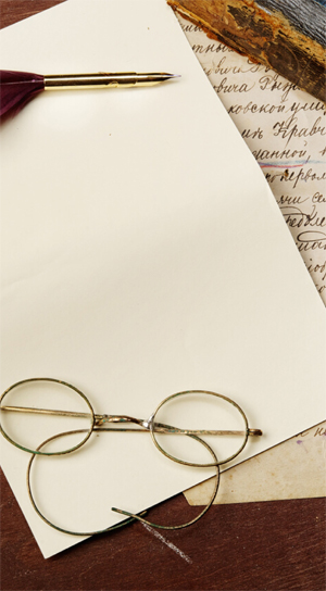 Eyeglasses on a sheet of paper