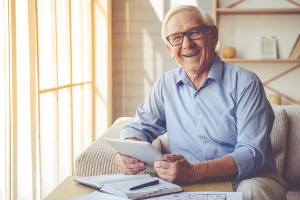 elderly man with glasses. smiling with thumbs up